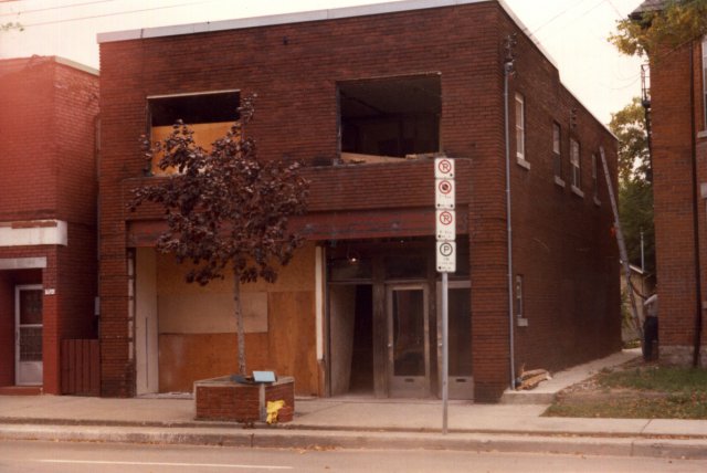 Perth Dupont Library under construction 1982: Circa. 1982, It was a woodworking shop owned by the Homonylo family who lived on the second floor before it was converted into the Perth/Dupont branch of the Toronto Public Library