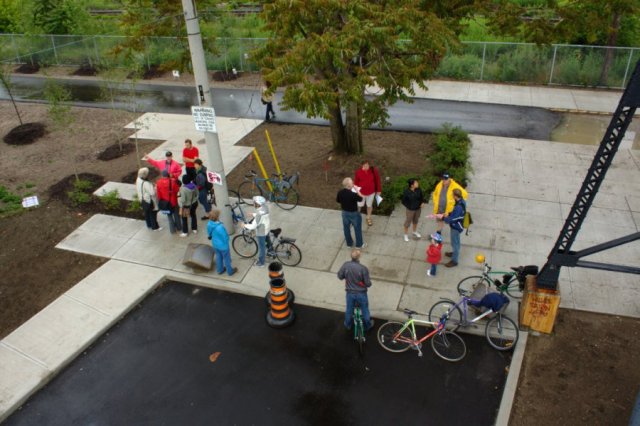  Cyclists, walkers, and other neighbours gathered at the Wallace Ave. entrance to the soon-to-be-finished West Toronto Railpath.  The "parade" was a celebration of the path's completion this year, and was part of the City of Toronto's "Bike Month" festivities.