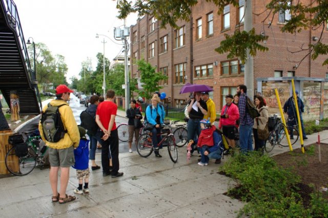  Friends and neighbours chatting, hoping the sky doesn't open up and "rain on our parade".