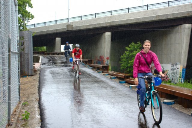  Riders on the Railpath parade head back north from Dundas St.