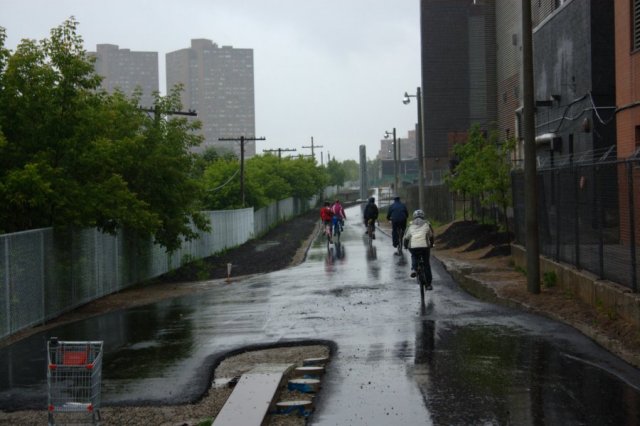  Riders on the Railpath parade head back north from Dundas St.